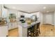 Modern kitchen with white cabinets, stainless steel appliances, and a center island at 116 Rose Ter, Wadesboro, NC 28170