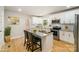 Bright kitchen featuring white cabinets, stainless steel appliances, and an island with seating at 116 Rose Ter, Wadesboro, NC 28170