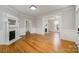 Spacious living room with hardwood floors, fireplace, and elegant white trim throughout the room at 116 Rose Ter, Wadesboro, NC 28170