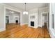 Open living room featuring hardwood floors, fireplace and large windows provide abundant natural light at 116 Rose Ter, Wadesboro, NC 28170