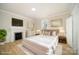 Inviting primary bedroom with hardwood floors, fireplace, and neutral decor at 116 Rose Ter, Wadesboro, NC 28170