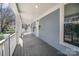 Cozy front porch with blue siding, a covered area, offering a charming and inviting entryway to the home at 116 Rose Ter, Wadesboro, NC 28170