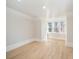 Bright room with light wood floors, white trim, and natural light from three large windows at 116 Rose Ter, Wadesboro, NC 28170