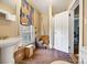 Bathroom features a pedestal sink, toilet, and window covered with cardboard at 121 York St, Chester, SC 29706