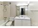 Bathroom with a tub/shower combo, vanity with cabinets, and mirrored medicine cabinet at 1323 Queens Rd # 308, Charlotte, NC 28207