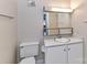 Bathroom featuring a toilet, sink and vanity with mirror and cabinet storage at 1323 Queens Rd # 308, Charlotte, NC 28207