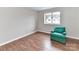 Bedroom with a chair, neutral color and hardwood floors at 1323 Queens Rd # 308, Charlotte, NC 28207