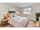Cozy bedroom with large window, stylish furniture, and soft neutral tones at 1323 Queens Rd # 308, Charlotte, NC 28207