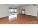 Bright living room featuring hardwood floors and a sliding glass door leading to a balcony at 1323 Queens Rd # 308, Charlotte, NC 28207