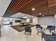 Stylish lobby features modern seating, elegant marble floors, and a unique wooden slat ceiling design at 1323 Queens Rd # 308, Charlotte, NC 28207