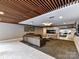 Inviting lobby area with comfortable leather seating, a cozy fireplace, and modern decor at 1323 Queens Rd # 308, Charlotte, NC 28207