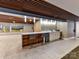 Lobby area includes a kitchenette with bar seating, with wood accents and white countertop at 1323 Queens Rd # 308, Charlotte, NC 28207