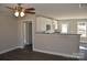 Open-concept kitchen with white cabinets, stainless appliances, granite countertops, and hardwood floors at 1410 Meadow Ave, Kannapolis, NC 28083