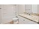A bathroom featuring a granite vanity and a shower-tub combination at 1412 Meadow Ave, Kannapolis, NC 28083