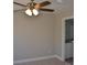 Neutral-toned bedroom with a view of the attached bathroom and ceiling fan at 1412 Meadow Ave, Kannapolis, NC 28083