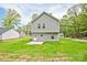 A exterior view of the back of the property with a spacious backyard at 1412 Meadow Ave, Kannapolis, NC 28083