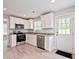 Charming kitchen features new appliances, granite counters, and bright natural light at 1412 Meadow Ave, Kannapolis, NC 28083