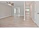 Bright and airy living room features light-toned walls, a ceiling fan, and seamless flow into adjacent spaces at 1412 Meadow Ave, Kannapolis, NC 28083