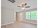 Cozy living room with light walls, wood-look floors, a ceiling fan, and lots of natural light from the window at 1412 Meadow Ave, Kannapolis, NC 28083