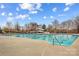Large community pool with slide for residents, set against a blue sky, great for summer fun at 14462 Holly Springs Dr, Huntersville, NC 28078