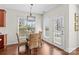 Dining area featuring a glass-top table, wicker chairs, and a view to the outside at 14462 Holly Springs Dr, Huntersville, NC 28078