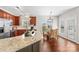 Open kitchen and dining area with granite countertops, stainless appliances, and natural light at 14462 Holly Springs Dr, Huntersville, NC 28078