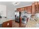 Well-equipped kitchen with stainless steel appliances and granite countertops at 14462 Holly Springs Dr, Huntersville, NC 28078