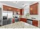 Functional kitchen featuring granite countertops, stainless steel appliances, and ample cabinet space at 14462 Holly Springs Dr, Huntersville, NC 28078