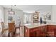Open-concept kitchen featuring granite countertops, stainless appliances, and a dining area at 14462 Holly Springs Dr, Huntersville, NC 28078