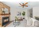 Cozy living room features a stone fireplace and ample seating at 14462 Holly Springs Dr, Huntersville, NC 28078