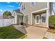 Cozy backyard patio with seating area and manicured lawn at 14462 Holly Springs Dr, Huntersville, NC 28078
