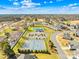 Aerial view showcasing neighborhood amenities including pool, tennis courts, and clubhouse at 146 Allenton Way, Statesville, NC 28677