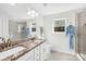 Bright bathroom features double sinks, granite countertops, large mirror, and a tiled glass-enclosed shower at 146 Allenton Way, Statesville, NC 28677