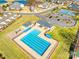 Aerial view of a community pool featuring tennis courts, a clubhouse, and ample parking at 146 Allenton Way, Statesville, NC 28677
