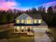 Charming two-story home with a welcoming front porch and attached two-car garage at 146 Allenton Way, Statesville, NC 28677