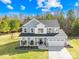 Charming two-story home with a welcoming front porch and attached two-car garage at 146 Allenton Way, Statesville, NC 28677