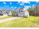 Charming two-story home featuring a welcoming front porch and a well-manicured lawn at 146 Allenton Way, Statesville, NC 28677