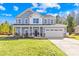 Lovely two-story home with a spacious driveway, a two-car garage and a welcoming porch at 146 Allenton Way, Statesville, NC 28677