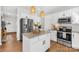 Beautiful kitchen features white cabinets, stainless steel appliances, and granite island countertop at 146 Allenton Way, Statesville, NC 28677