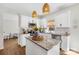 Bright kitchen with white cabinets, pendant lighting, and granite countertops on the central island at 146 Allenton Way, Statesville, NC 28677