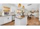 Open concept design from kitchen to the living room creates an inviting space for entertaining at 146 Allenton Way, Statesville, NC 28677