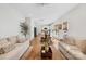 Bright, open-concept living area with hardwood floors, connecting the living room to the kitchen at 146 Allenton Way, Statesville, NC 28677