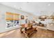 Bright living area featuring a large wooden table and bench, plus a comfortable sitting area at 146 Allenton Way, Statesville, NC 28677