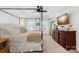 The main bedroom features a four-poster bed, natural light and a dresser with a TV at 146 Allenton Way, Statesville, NC 28677