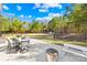 Cozy patio with outdoor seating, a fire pit, and a backyard view, perfect for relaxation at 146 Allenton Way, Statesville, NC 28677