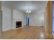 Bright living room featuring hardwood floors, a fireplace, and ample natural light at 154 Bingham Dr, Charlotte, NC 28213