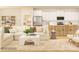 Open-concept living room with kitchen view, plush sofa, and neutral decor at 1566 Croydon St, Indian Land, SC 29707