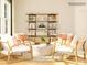 Bright living room featuring four modern chairs, round coffee table, and stylish bookshelf at 1566 Croydon St, Indian Land, SC 29707
