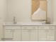 Elegant wet bar featuring sleek countertops, ample cabinet space, and stylish fixtures, perfect for entertaining guests and relaxing at 1566 Croydon St, Indian Land, SC 29707