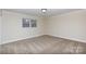 Bright bedroom featuring neutral walls, plush carpet, and a window with natural light at 1825 Hyatt Ave, Rock Hill, SC 29732